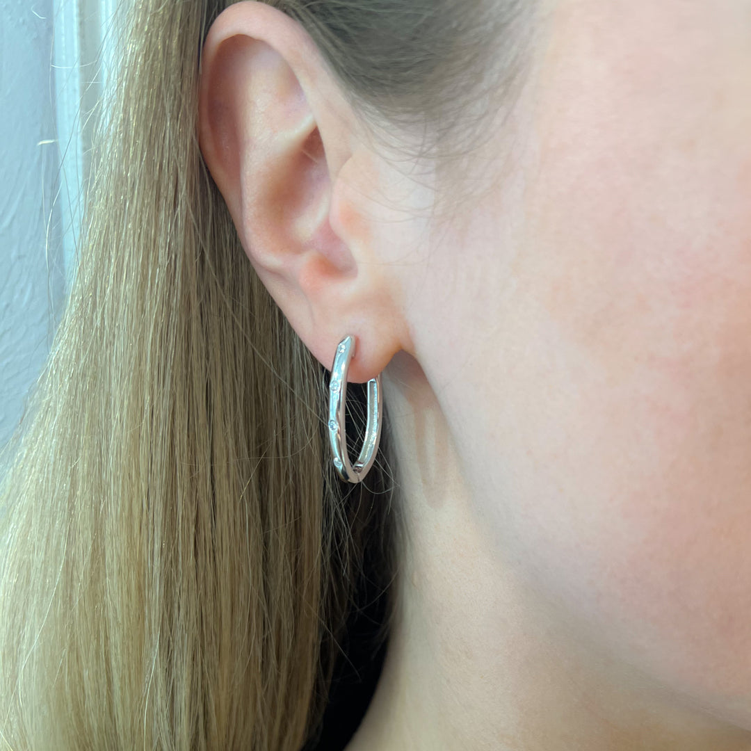 Platinum Zircon Sterling Silver Oval Hoop Earrings